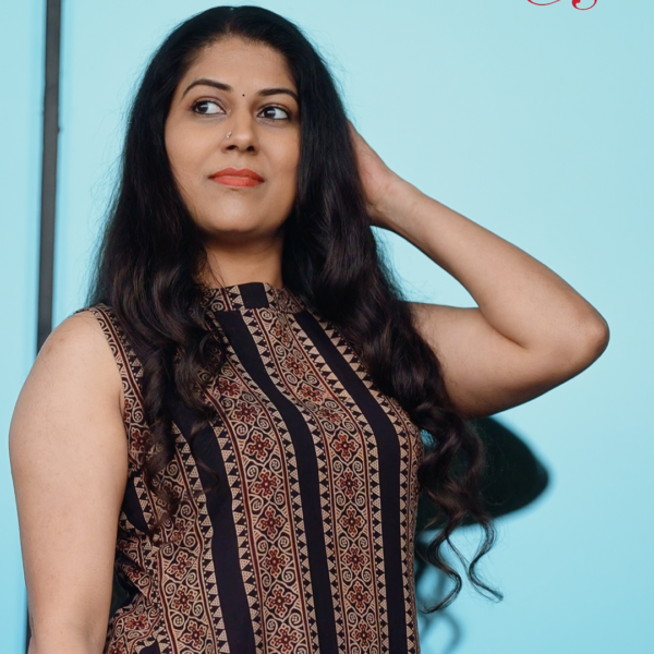 Woman wearing Chilangara fusion wear sleeveless dress.