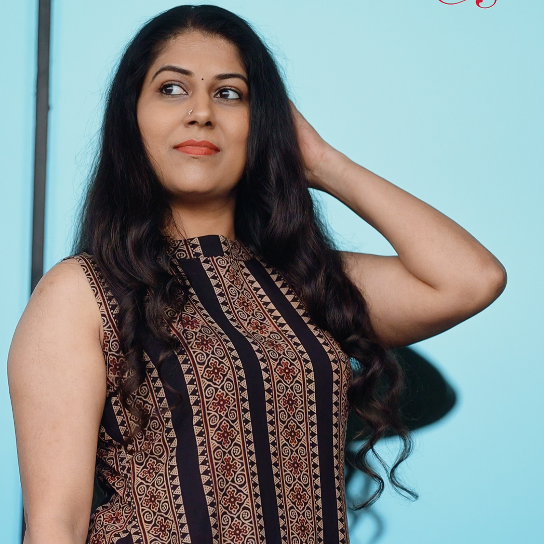 Woman wearing Chilangara fusion wear sleeveless dress.