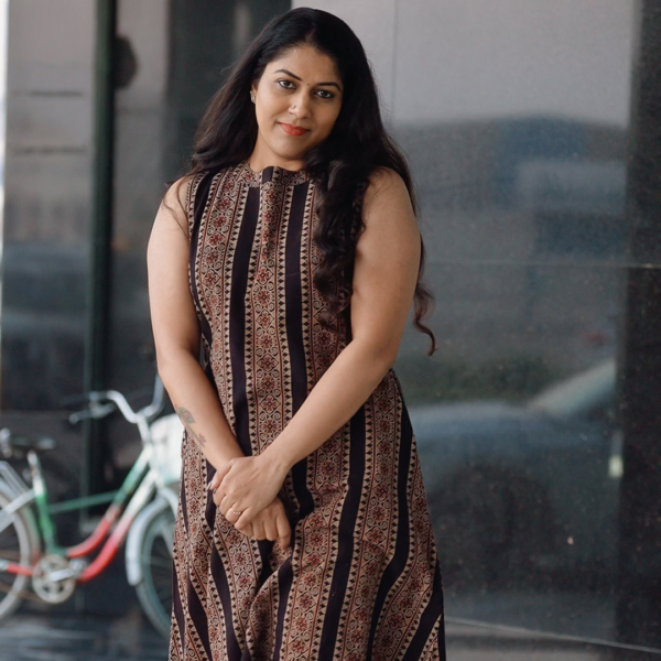 Woman wearing Chilangara fusion wear sleeveless dress.